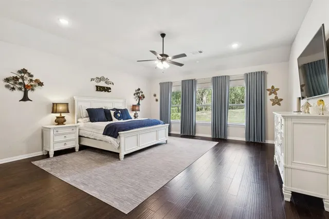 a bed room with a bed and a chandelier