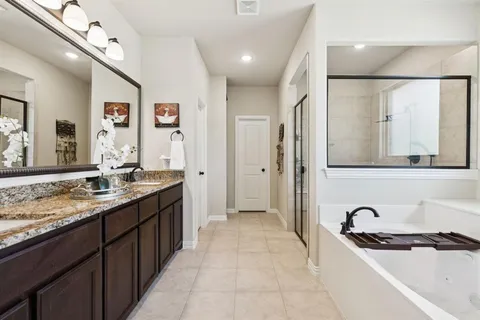 a kitchen with granite countertop a sink and cabinets