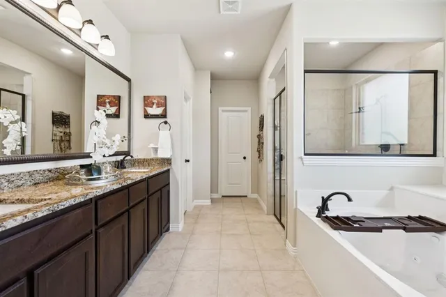a kitchen with granite countertop a sink and cabinets
