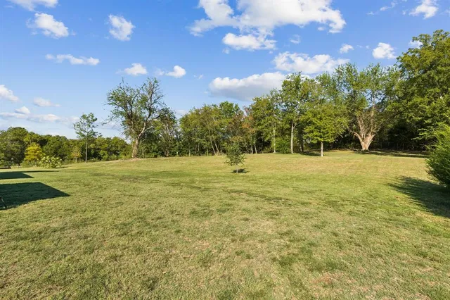 a swimming pool is in the middle of a field
