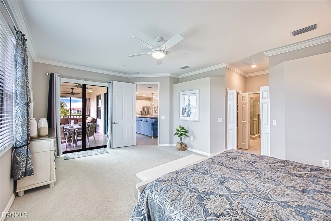 12000 Hawthorn Lake Drive, Unit 202 Fort Myers, FL 33913 - Photo 17 of 49 a bedroom with a large bed and a large window