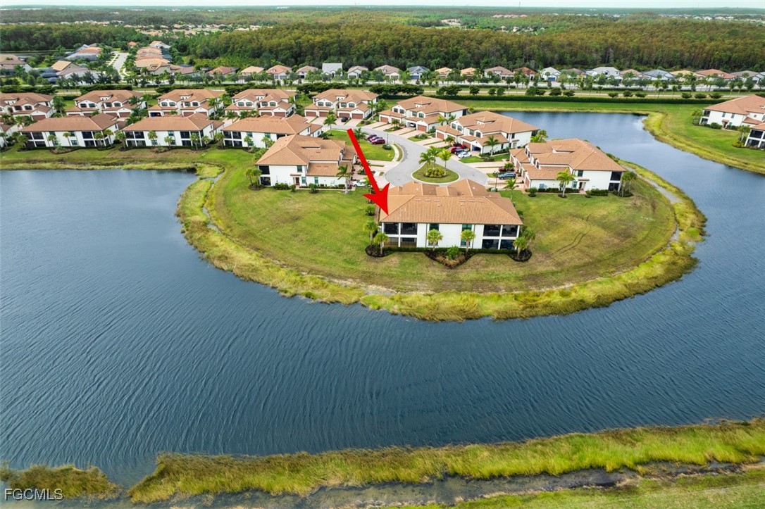 12000 Hawthorn Lake Drive, Unit 202 Fort Myers, FL 33913 - Photo 2 of 49 an aerial view of a house with a lake view