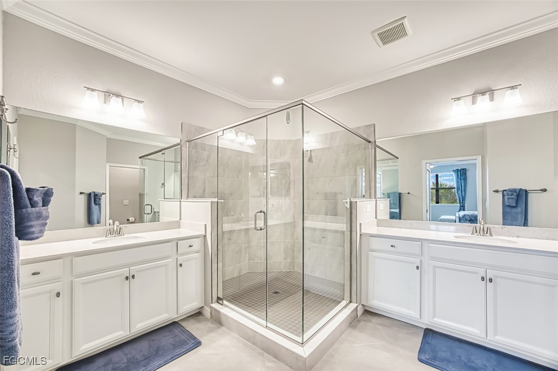12000 Hawthorn Lake Drive, Unit 202 Fort Myers, FL 33913 - Photo 21 of 49 a bathroom with a shower sink and mirror