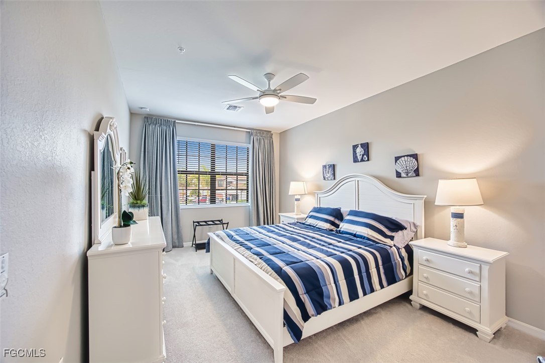 12000 Hawthorn Lake Drive, Unit 202 Fort Myers, FL 33913 - Photo 25 of 49 a bedroom with a bed and window