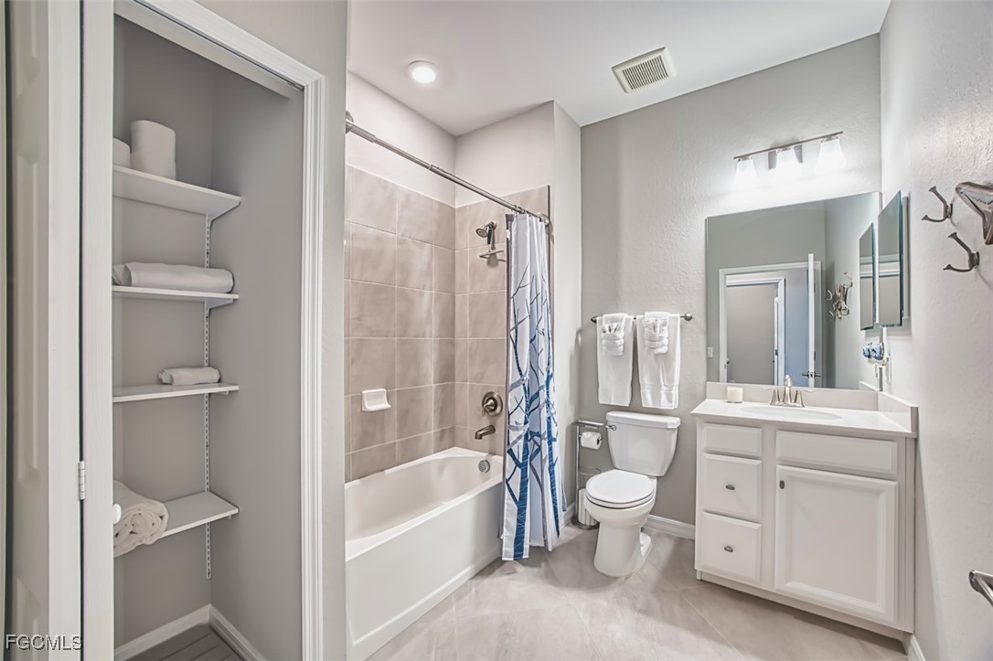 12000 Hawthorn Lake Drive, Unit 202 Fort Myers, FL 33913 - Photo 27 of 49 a bathroom with a toilet a sink and a bathtub