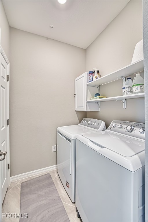 12000 Hawthorn Lake Drive, Unit 202 Fort Myers, FL 33913 - Photo 31 of 49 a utility room with dryer and washer