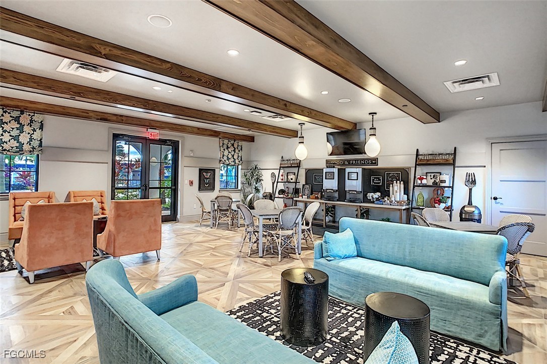 12000 Hawthorn Lake Drive, Unit 202 Fort Myers, FL 33913 - Photo 41 of 49 a living room with furniture and a view