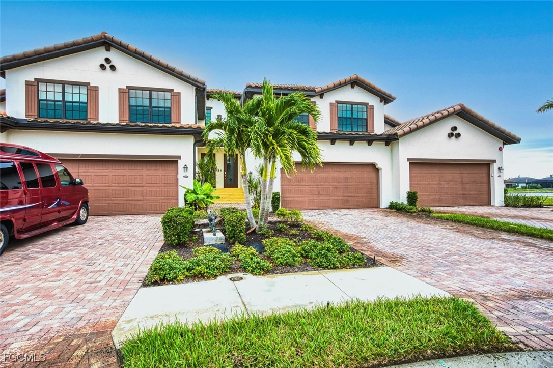 12000 Hawthorn Lake Drive, Unit 202 Fort Myers, FL 33913 - Photo 42 of 49 a house view with a garden space