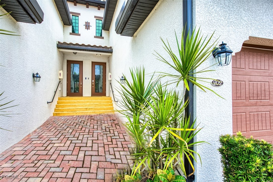 12000 Hawthorn Lake Drive, Unit 202 Fort Myers, FL 33913 - Photo 44 of 49 a front view of a house with a yard