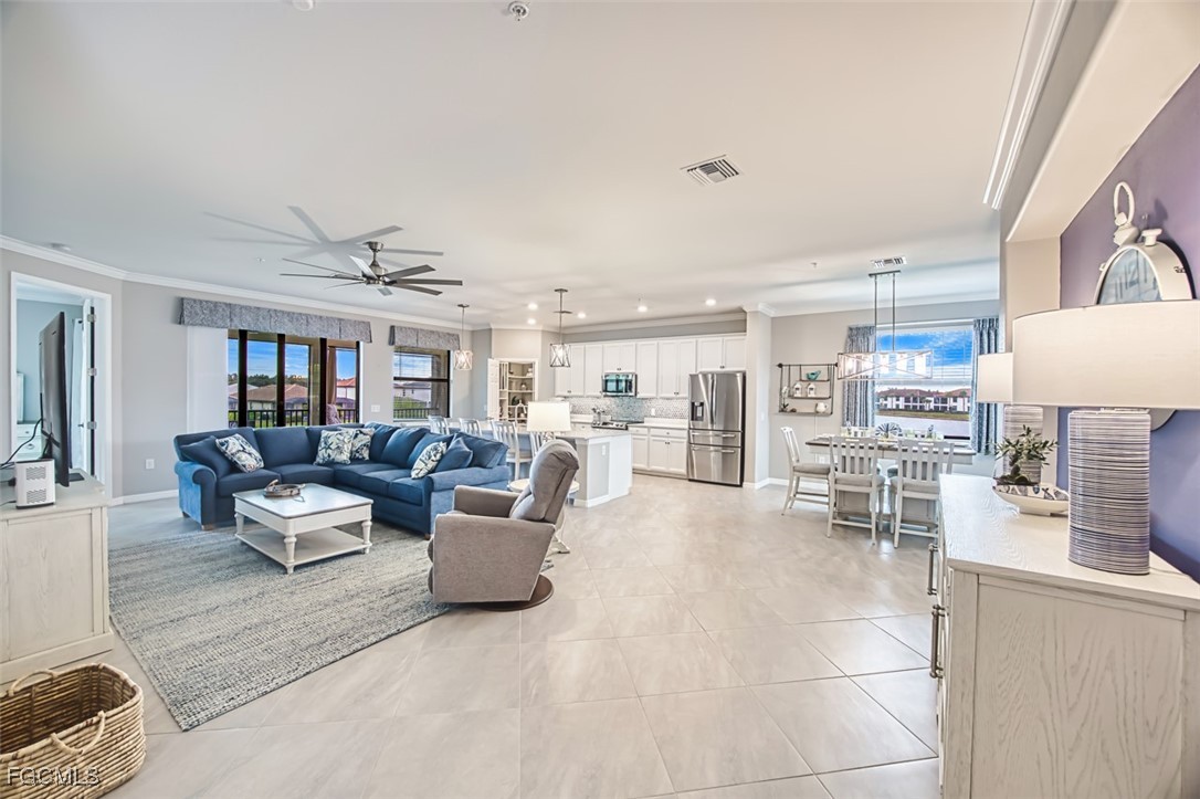12000 Hawthorn Lake Drive, Unit 202 Fort Myers, FL 33913 - Photo 8 of 49 a living room with furniture and a view of kitchen