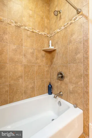 a room with table chairs and a flat screen tv