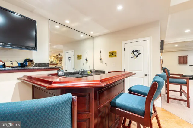 a front view of a house with a yard table and chairs