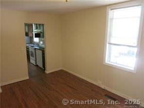 983 Riverside Drive Thompson, CT 06255 - Photo 5 of 16 a view of a kitchen with wooden floor and a window