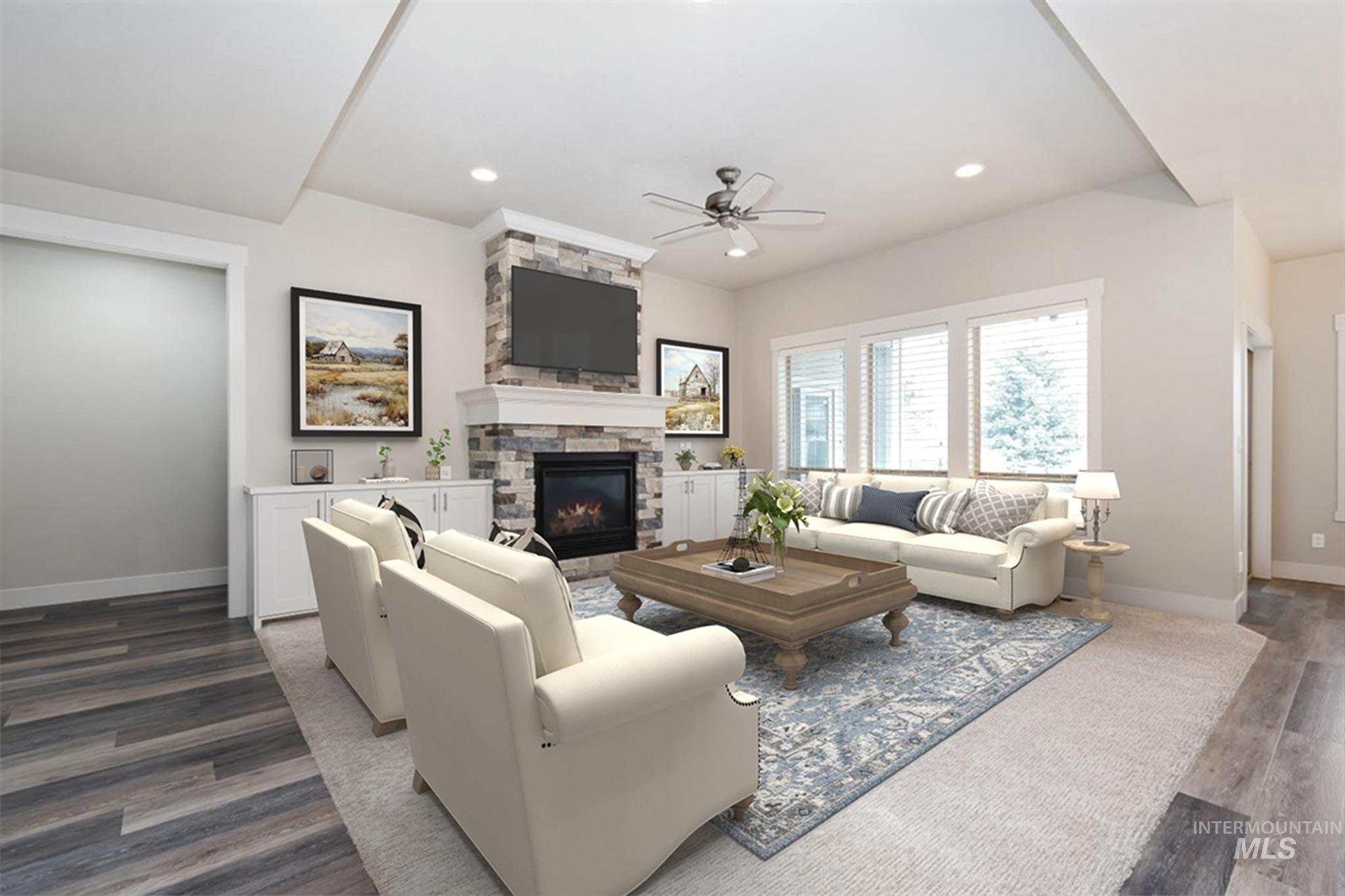 9580 West Ringle Creek Street Star, ID 83669 - Photo 11 of 43 Living room with wood finished floors, ceiling fan, a fireplace, and recessed lighting
