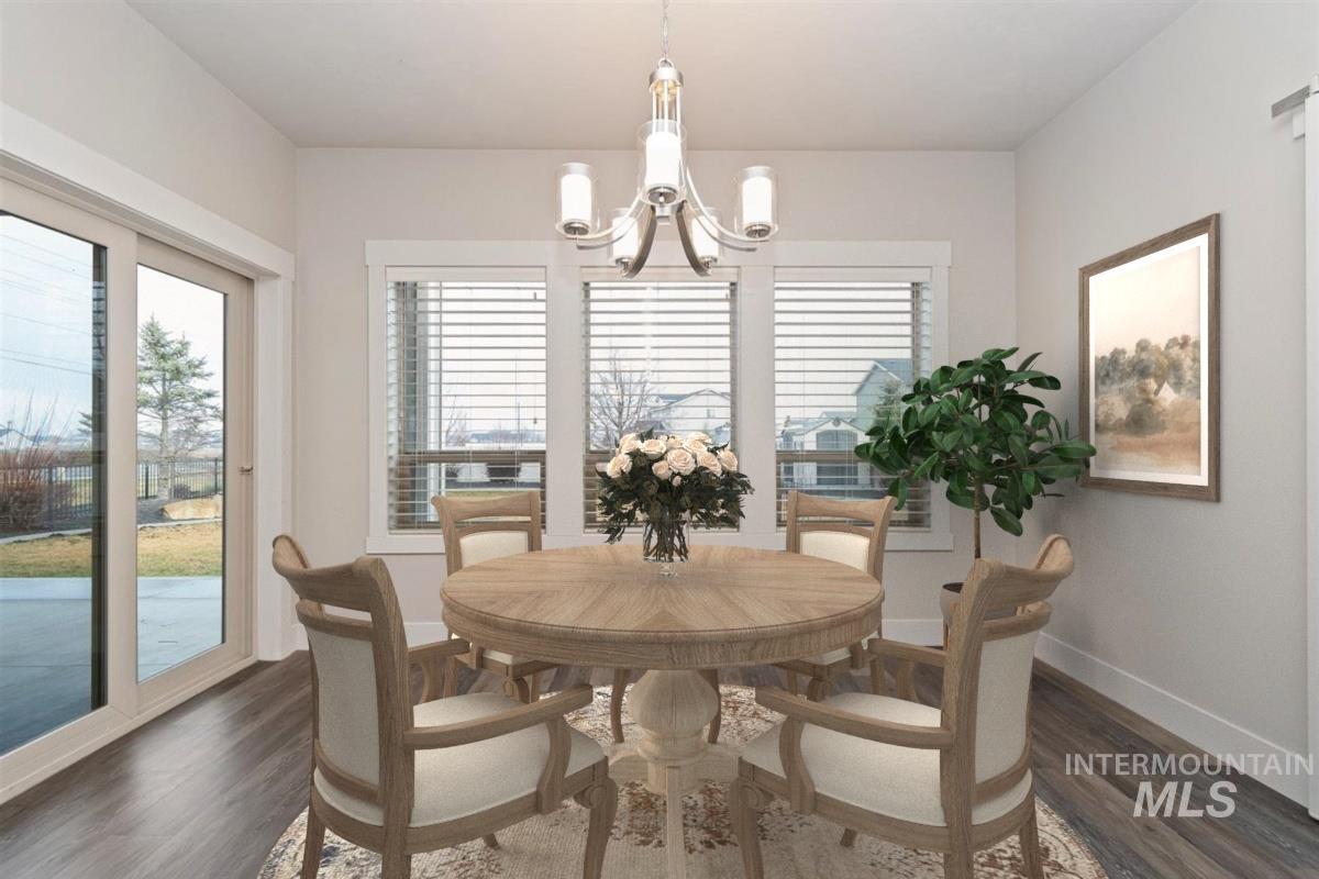 9580 West Ringle Creek Street Star, ID 83669 - Photo 19 of 43 Dining room featuring wood finished floors and hanging lights