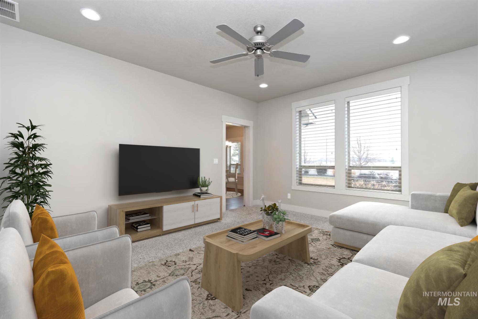 9580 West Ringle Creek Street Star, ID 83669 - Photo 22 of 43 Carpeted living room featuring a ceiling fan and recessed lighting