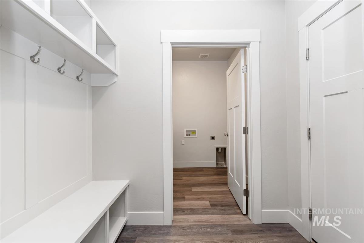 9580 West Ringle Creek Street Star, ID 83669 - Photo 36 of 43 Mudroom featuring dark wood-type flooring and baseboards