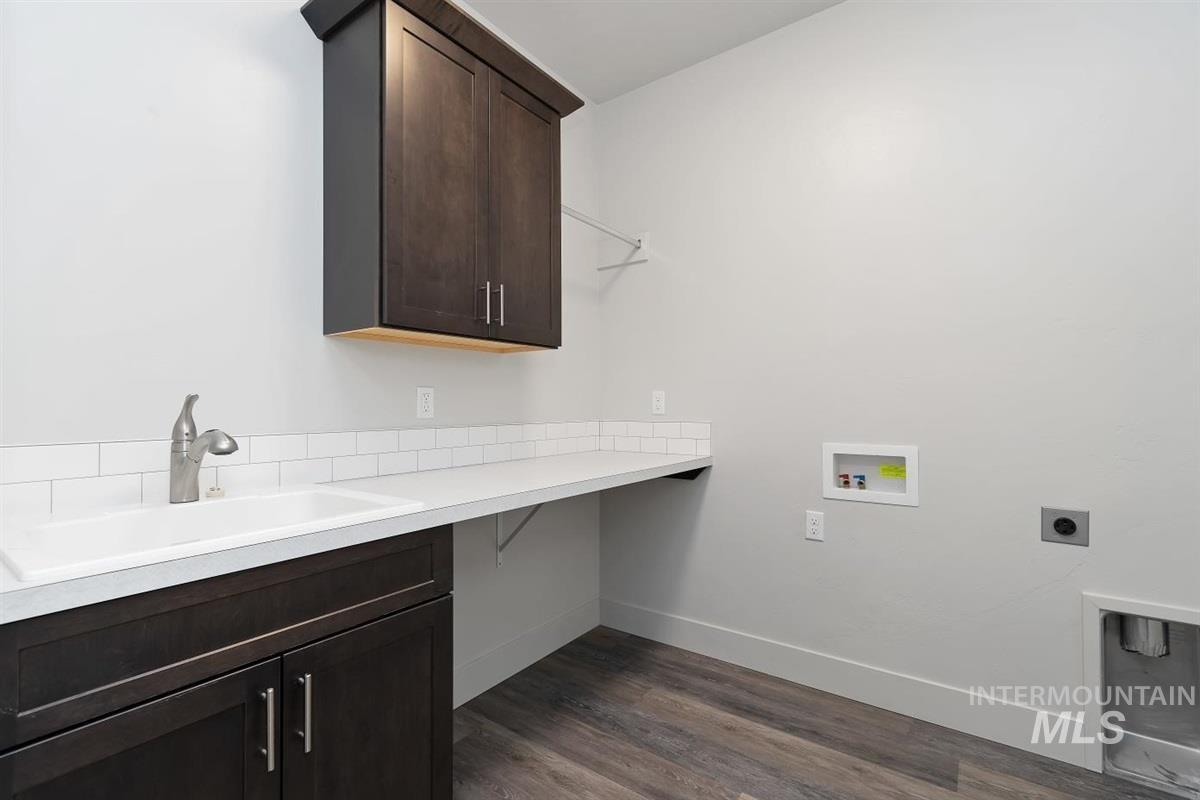 9580 West Ringle Creek Street Star, ID 83669 - Photo 37 of 43 Laundry area with cabinet space, dark wood-type flooring, washer hookup, and electric dryer hookup
