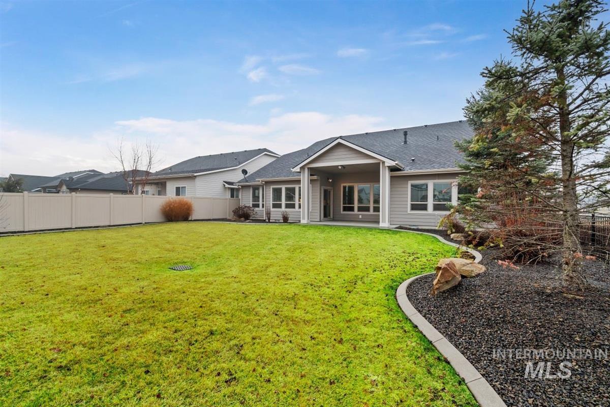 9580 West Ringle Creek Street Star, ID 83669 - Photo 40 of 43 Rear view of property featuring a patio area, a fenced backyard, and roof with shingles