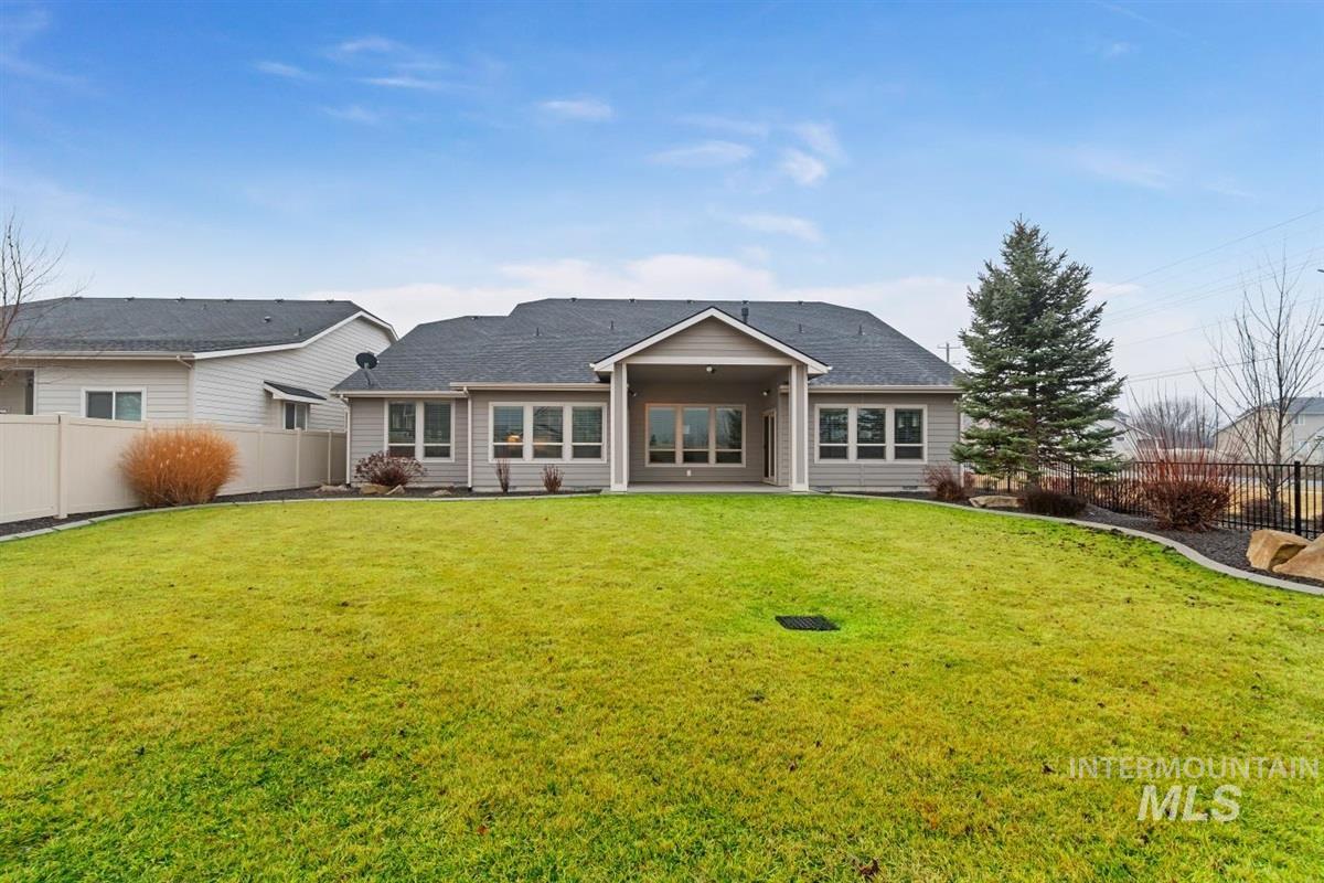 9580 West Ringle Creek Street Star, ID 83669 - Photo 41 of 43 Back of property with a fenced backyard and a patio