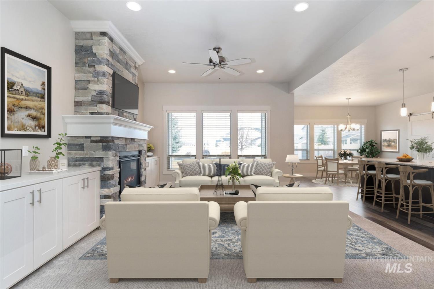 9580 West Ringle Creek Street Star, ID 83669 - Photo 9 of 43 Living room with a ceiling fan, a fireplace, light wood finished floors, and recessed lighting