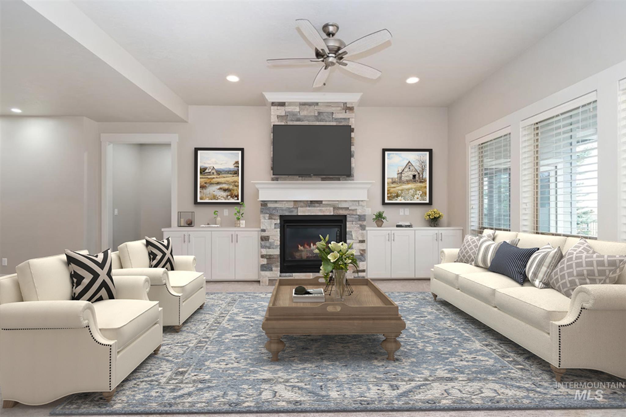 9580 West Ringle Creek Street Star, ID 83669 - Photo 10 of 43 Carpeted living room featuring ceiling fan, a stone fireplace, and recessed lighting