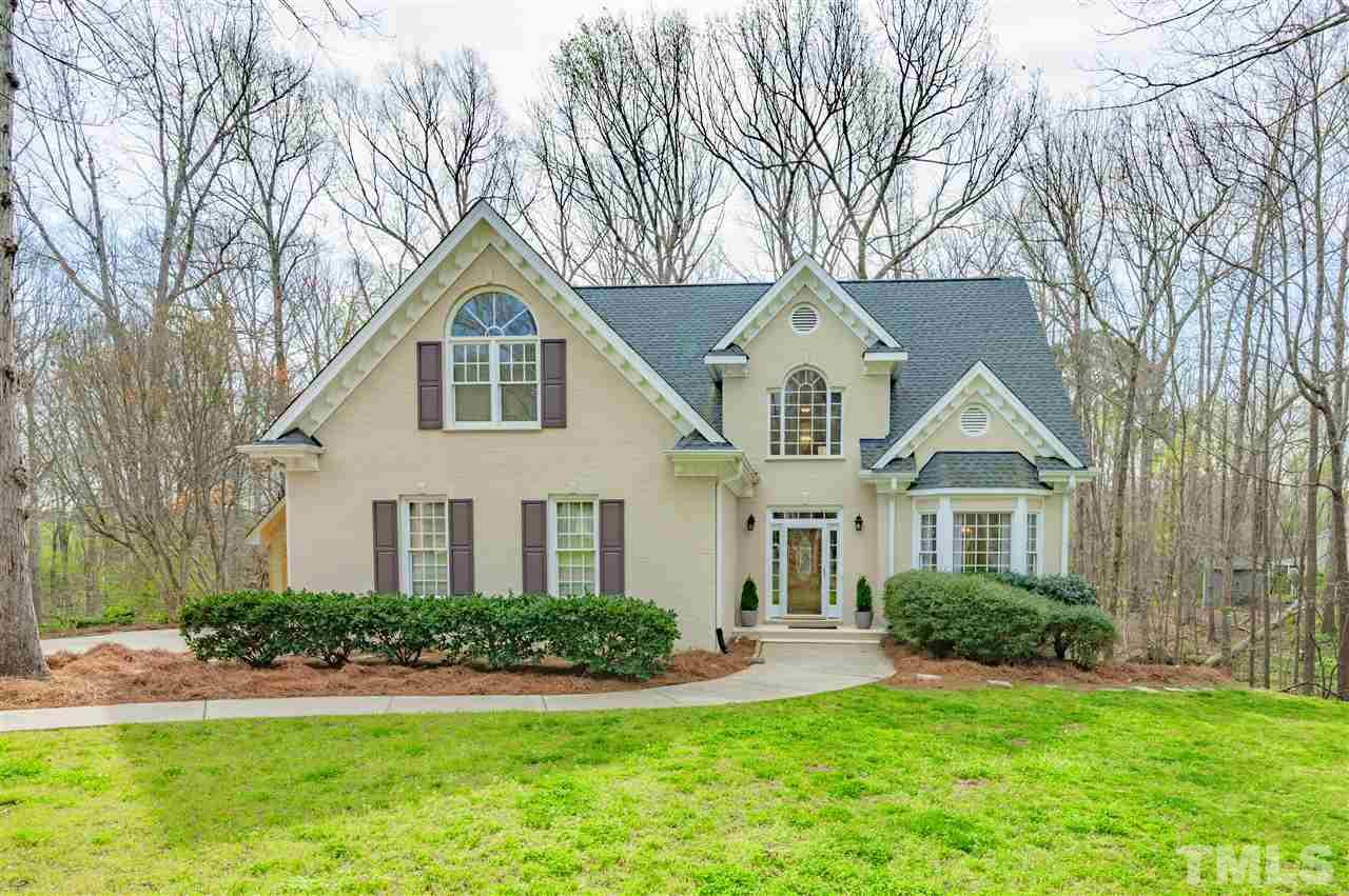 6208 Hampton Ridge Road Raleigh, NC 27603 - Photo 1 of 30 a front view of a house with a yard and trees