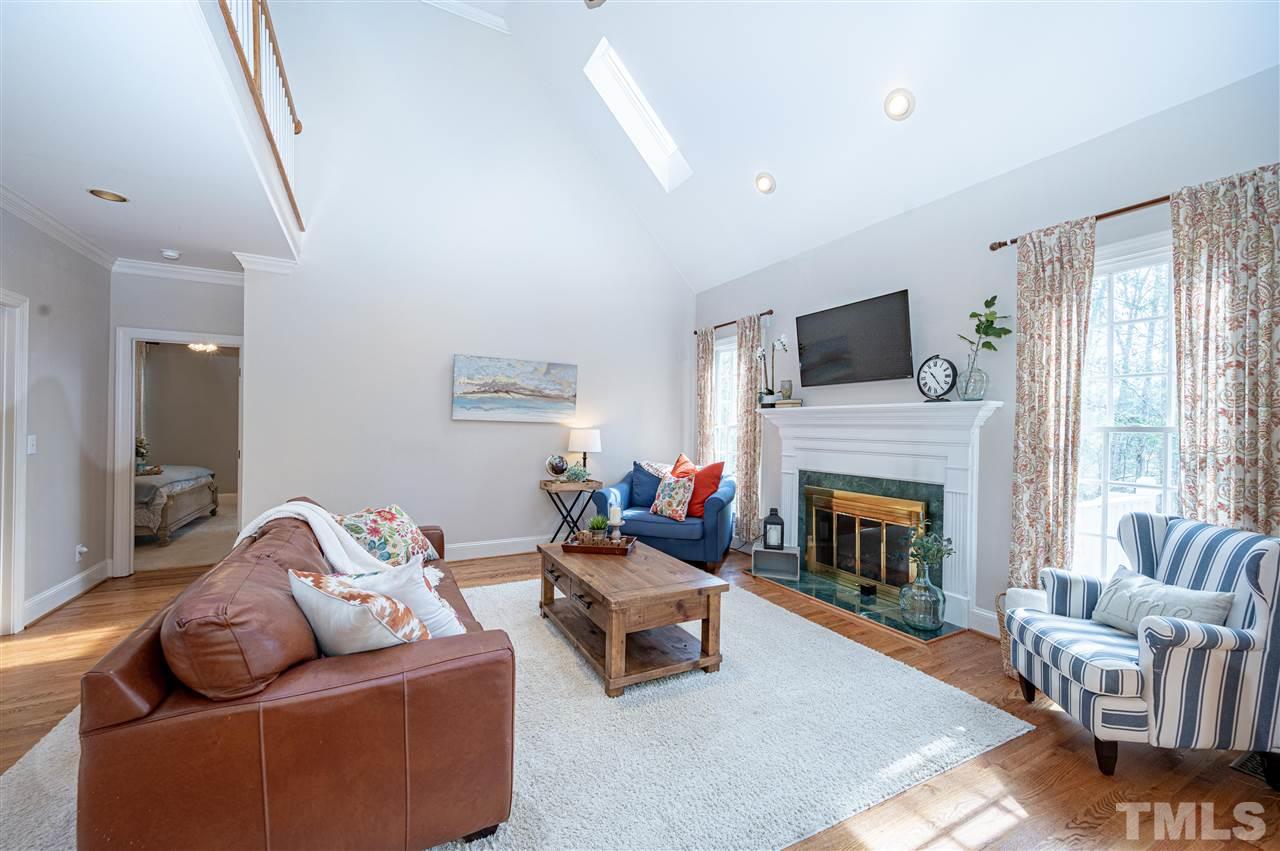 6208 Hampton Ridge Road Raleigh, NC 27603 - Photo 13 of 30 a living room with furniture fireplace and flat screen tv