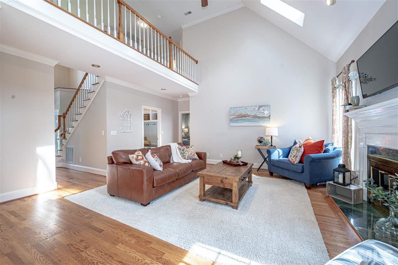 6208 Hampton Ridge Road Raleigh, NC 27603 - Photo 19 of 30 a living room with furniture and a fireplace
