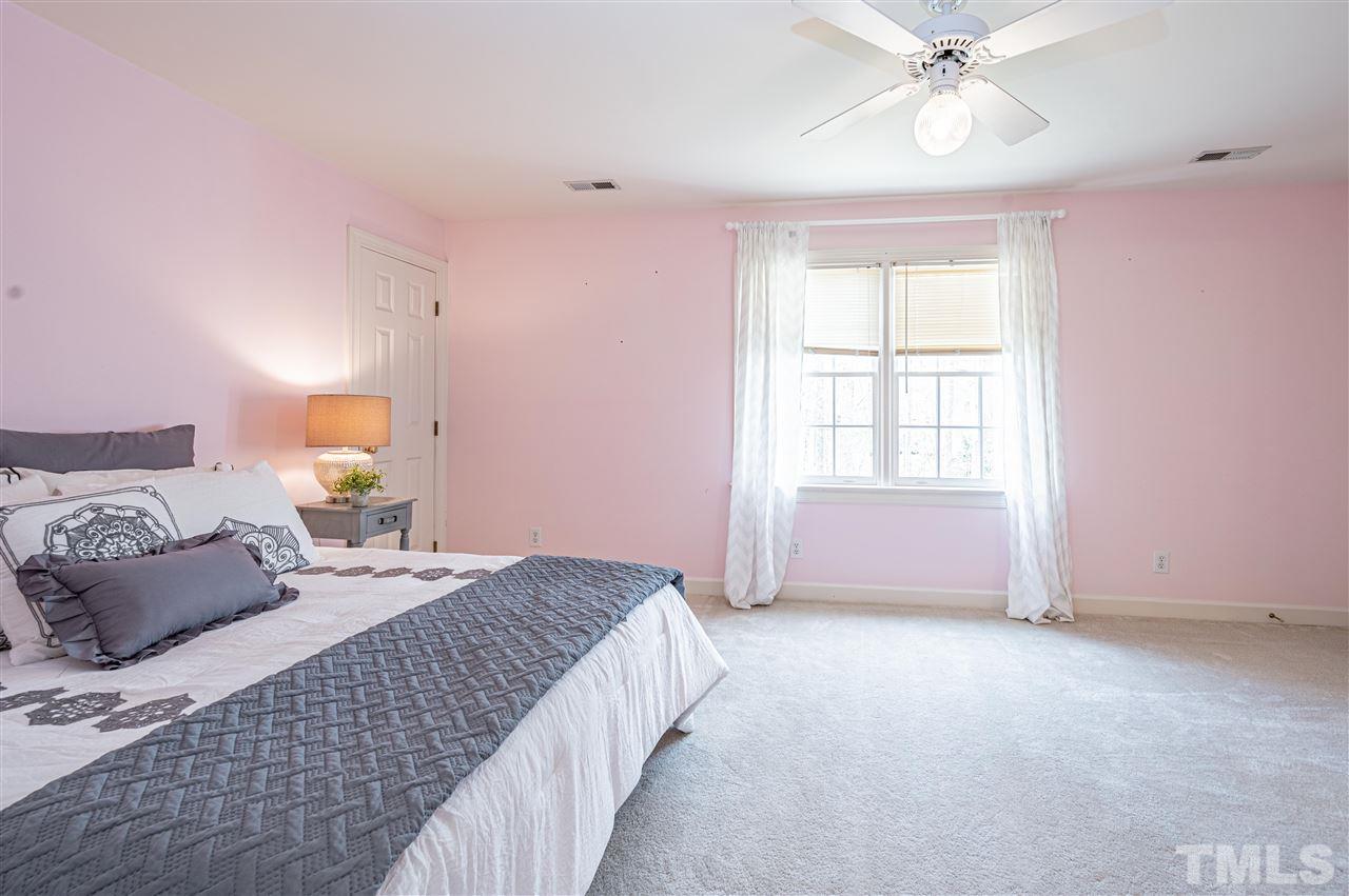 6208 Hampton Ridge Road Raleigh, NC 27603 - Photo 25 of 30 a bedroom with a bed and a window
