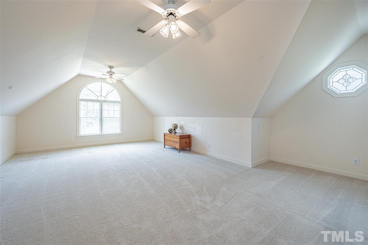 6208 Hampton Ridge Road Raleigh, NC 27603 - Photo 28 of 30 an empty room with windows and fan