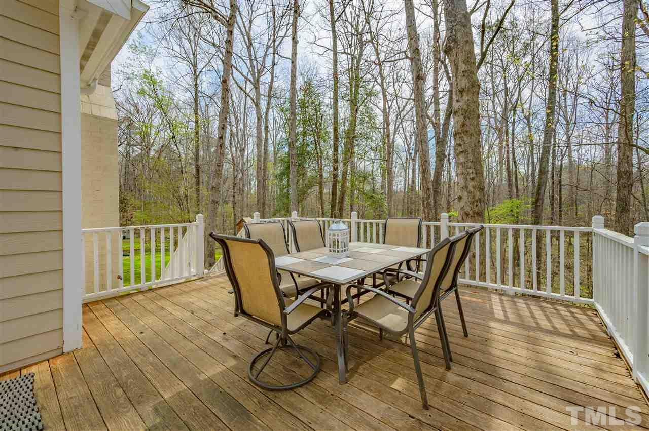 6208 Hampton Ridge Road Raleigh, NC 27603 - Photo 29 of 30 a view of a chairs and table on the deck