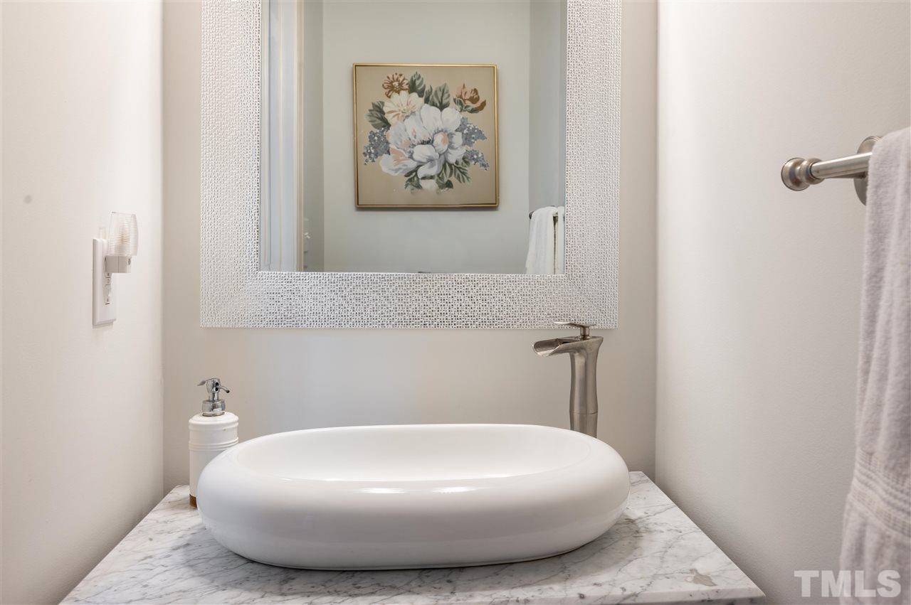 6208 Hampton Ridge Road Raleigh, NC 27603 - Photo 7 of 30 a white tub sitting in a bathroom