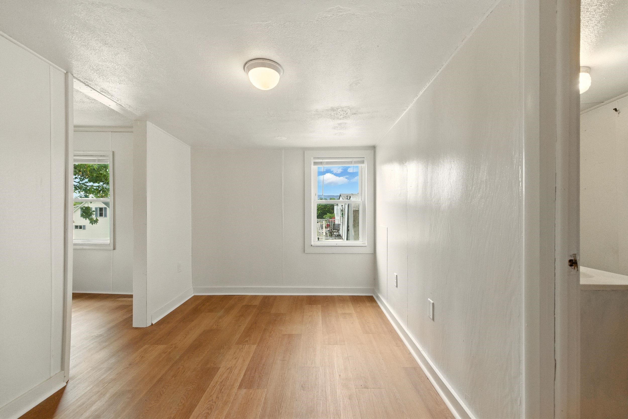 17801 Red Brush Road Elkton, VA 22827 - Photo 17 of 48 wooden floor in an empty room with a window