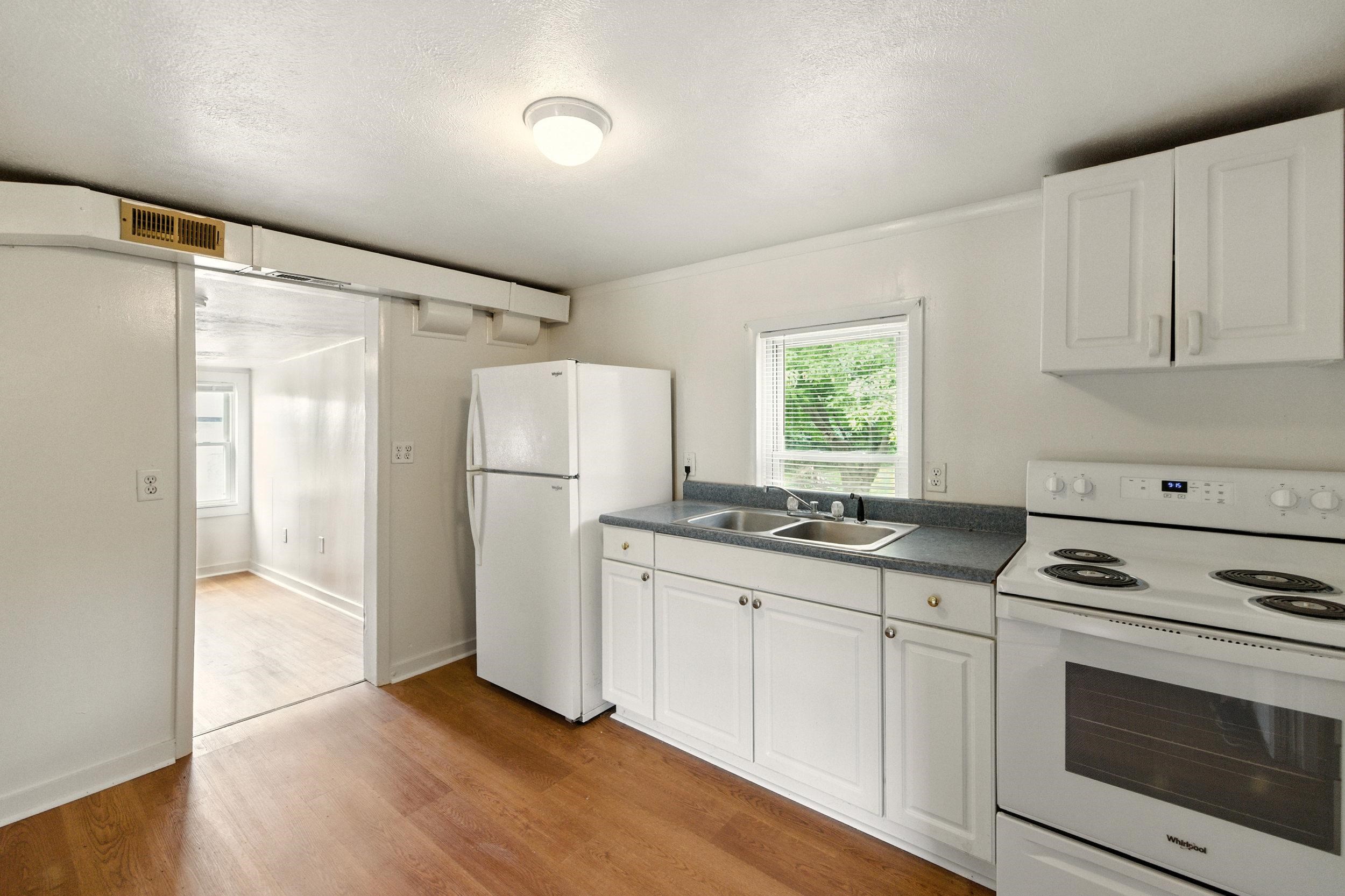 17801 Red Brush Road Elkton, VA 22827 - Photo 2 of 48 a kitchen with granite countertop a refrigerator sink and stove