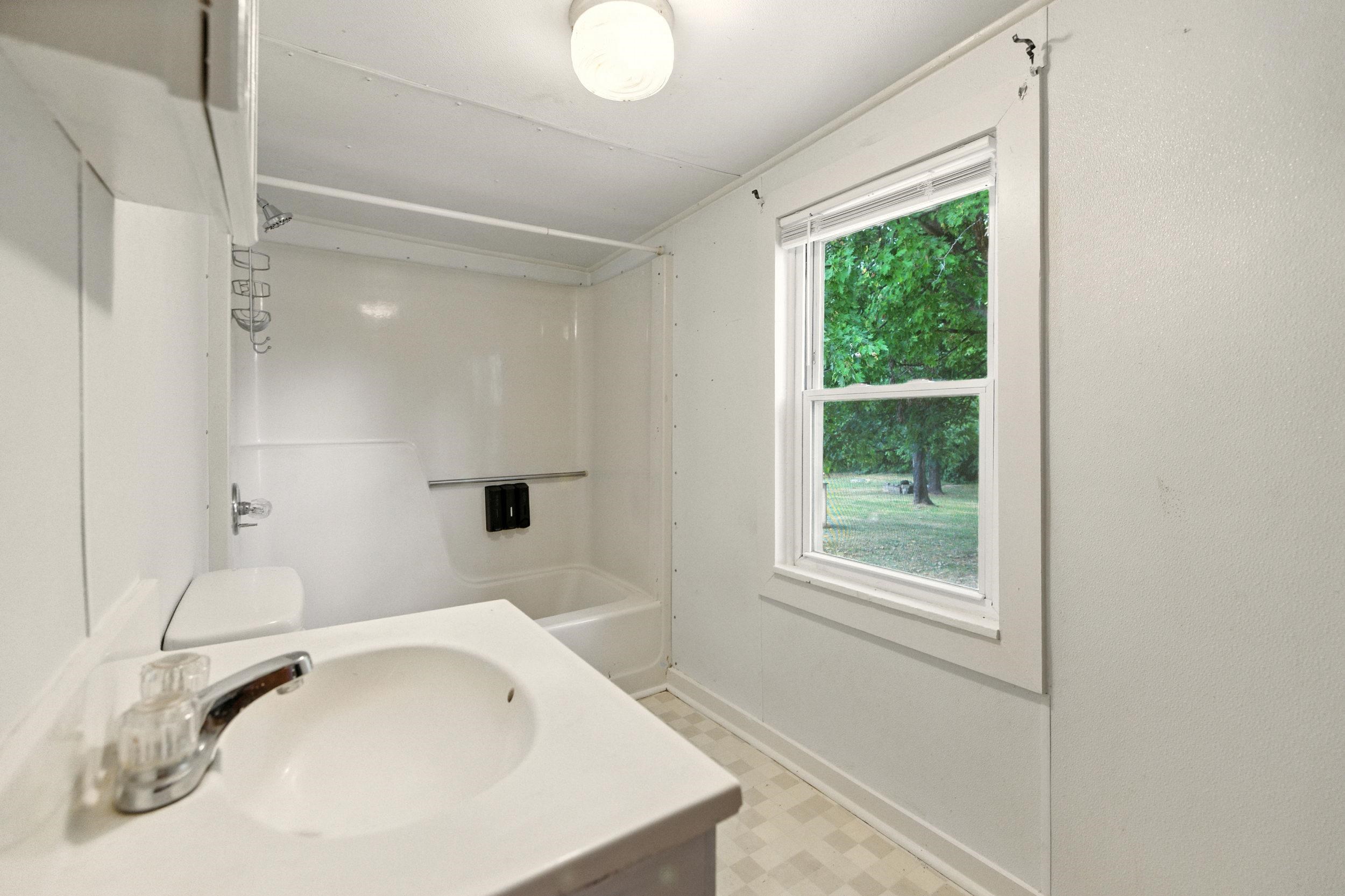 17801 Red Brush Road Elkton, VA 22827 - Photo 21 of 48 a bathroom with a tub and a sink