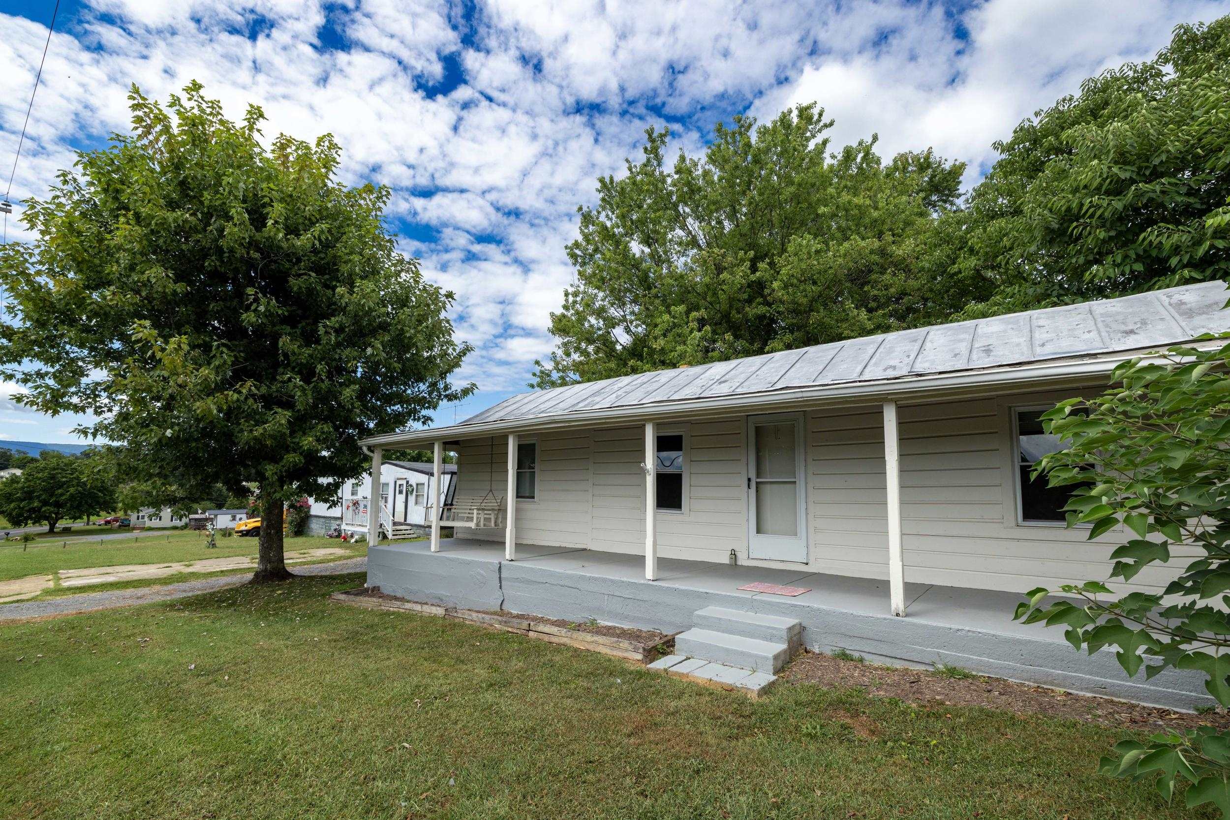 17801 Red Brush Road Elkton, VA 22827 - Photo 22 of 48 a front view of a house with a garden