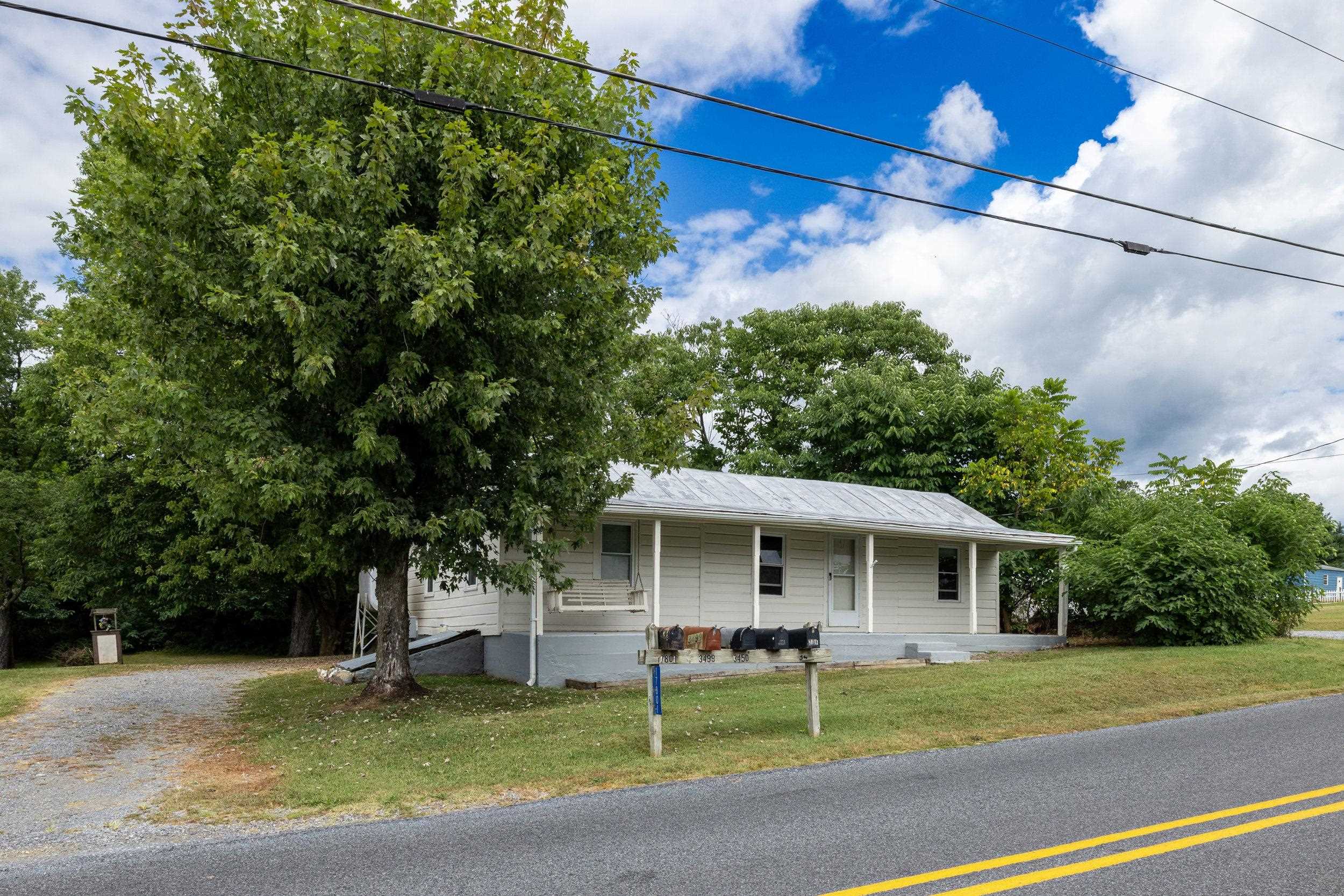 17801 Red Brush Road Elkton, VA 22827 - Photo 23 of 48 a front view of a house with a garden and trees