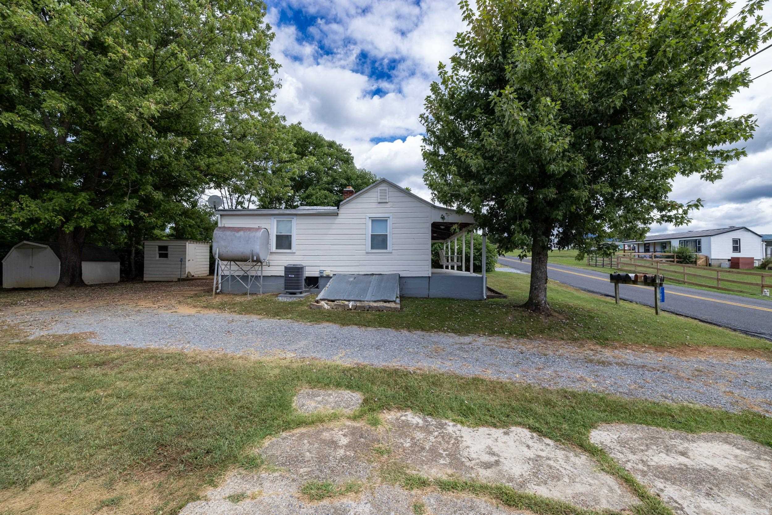 17801 Red Brush Road Elkton, VA 22827 - Photo 30 of 48 a view of a house with a yard and large tree