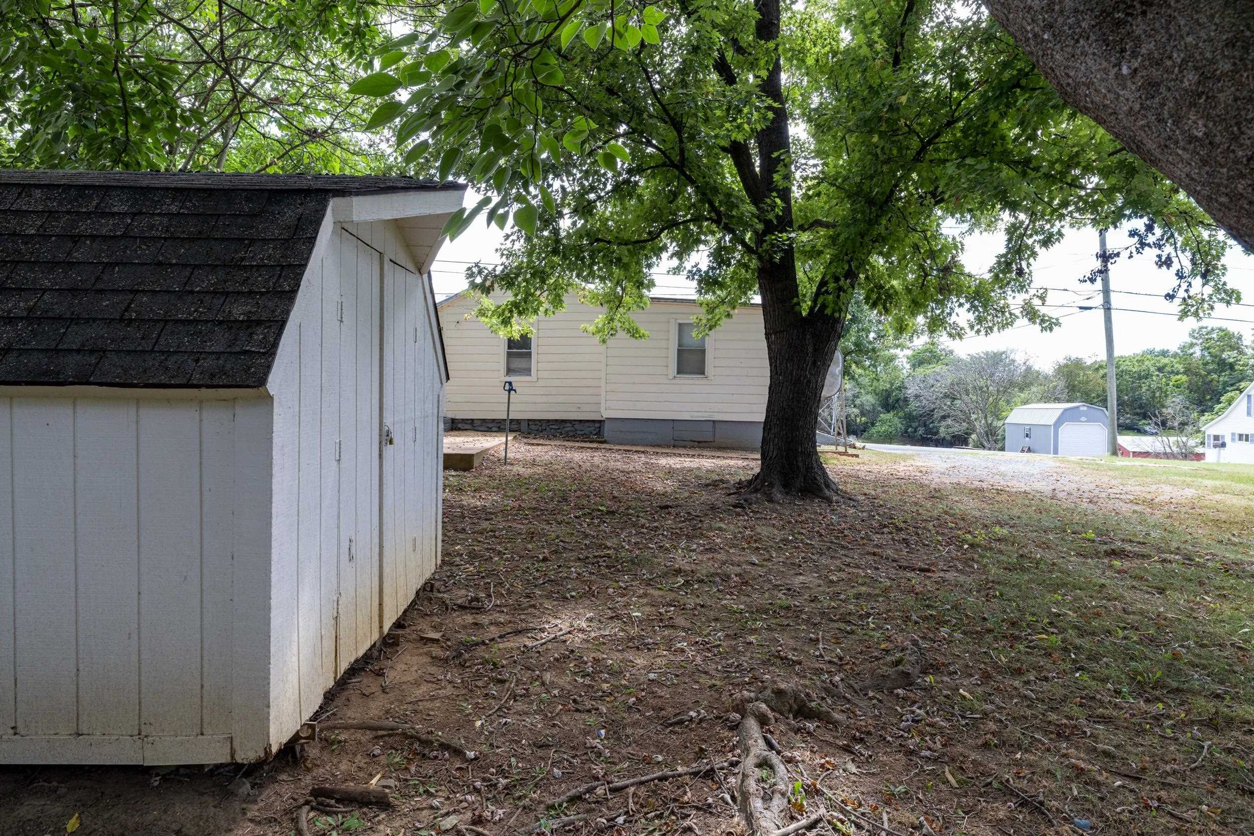 17801 Red Brush Road Elkton, VA 22827 - Photo 35 of 48 a view of a backyard with large trees and wooden fence
