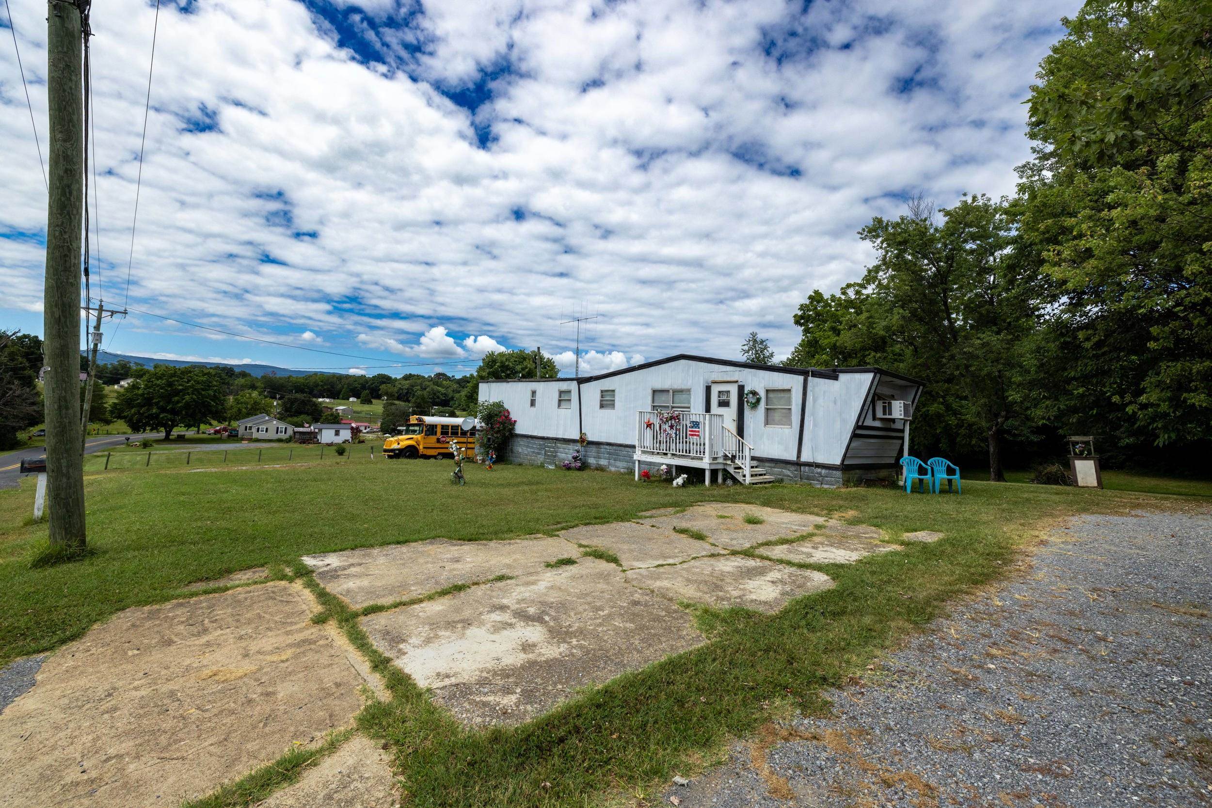 17801 Red Brush Road Elkton, VA 22827 - Photo 38 of 48 a view of a big house with a big yard and large tree