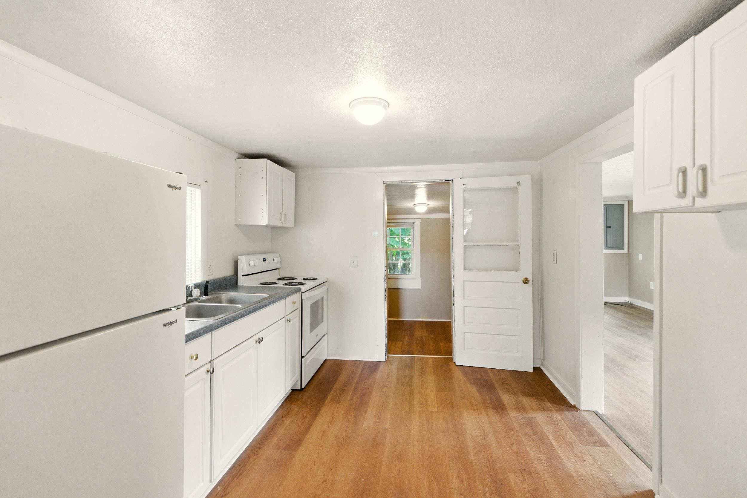 17801 Red Brush Road Elkton, VA 22827 - Photo 4 of 48 a kitchen with a sink a refrigerator and wooden floor