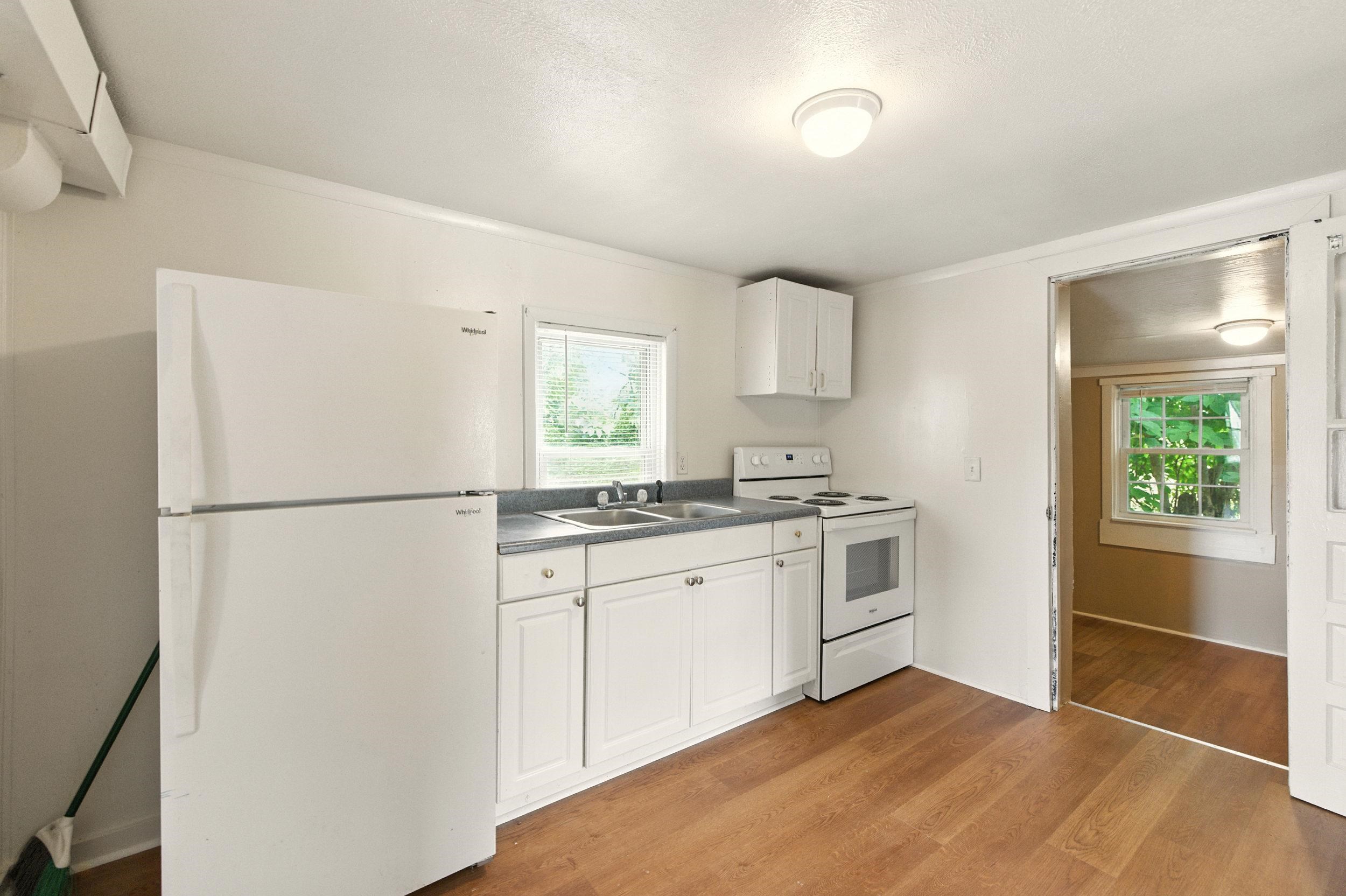 17801 Red Brush Road Elkton, VA 22827 - Photo 5 of 48 a kitchen with a white cabinets and white appliances