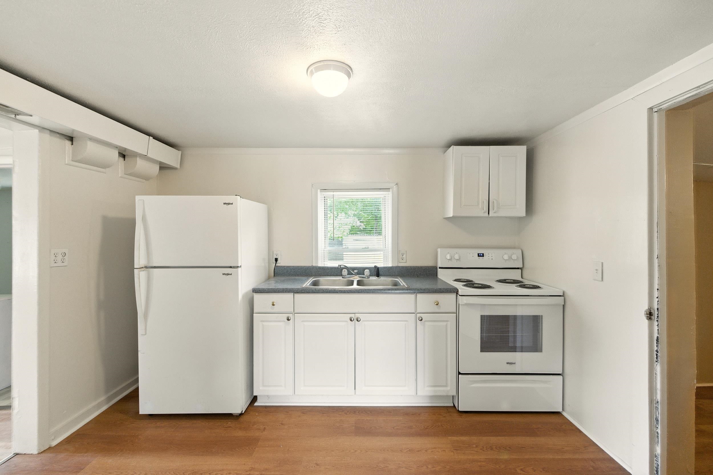 17801 Red Brush Road Elkton, VA 22827 - Photo 6 of 48 a kitchen with a white cabinets and white appliances