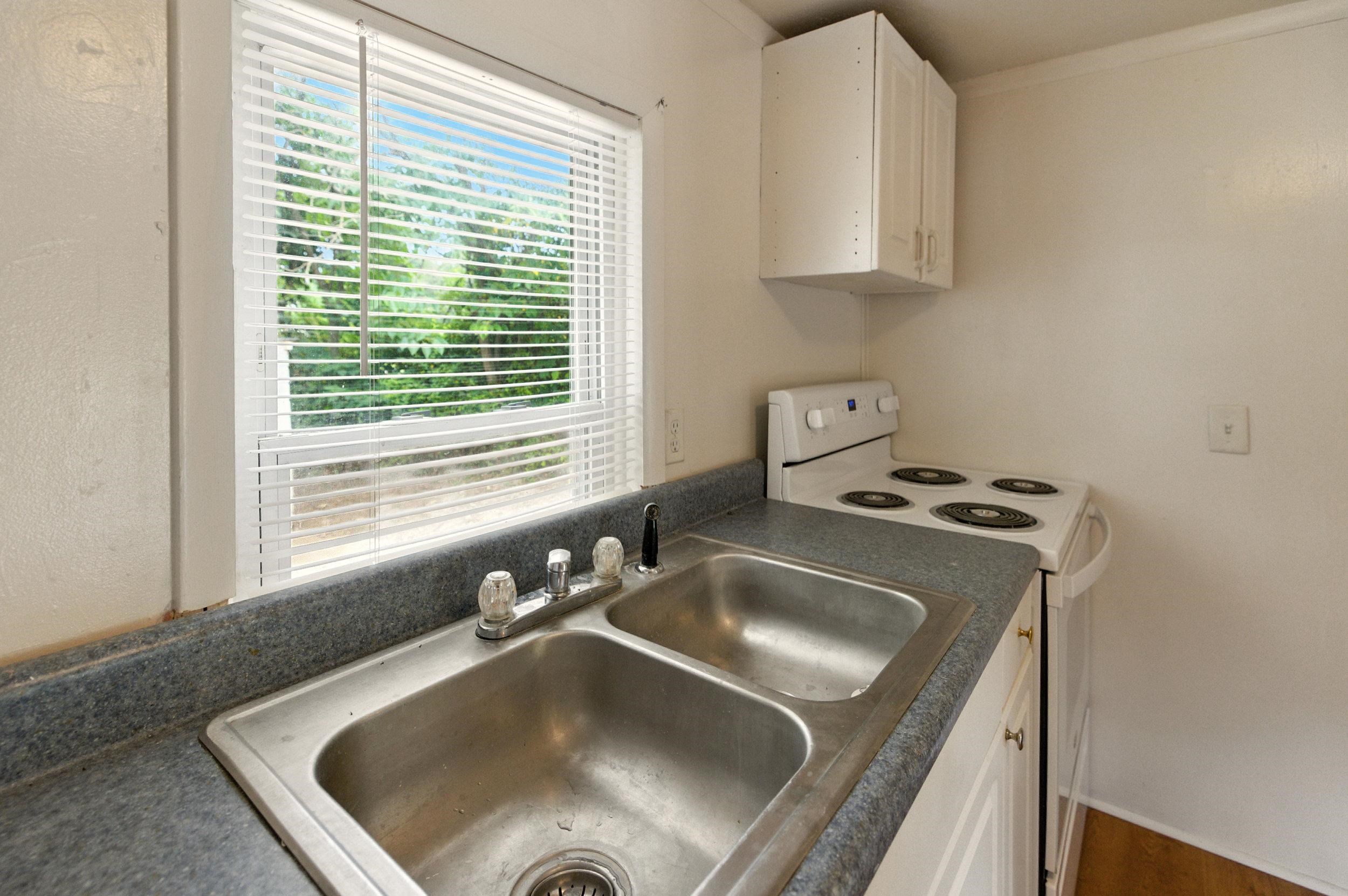 17801 Red Brush Road Elkton, VA 22827 - Photo 7 of 48 a kitchen with a sink a stove and a microwave