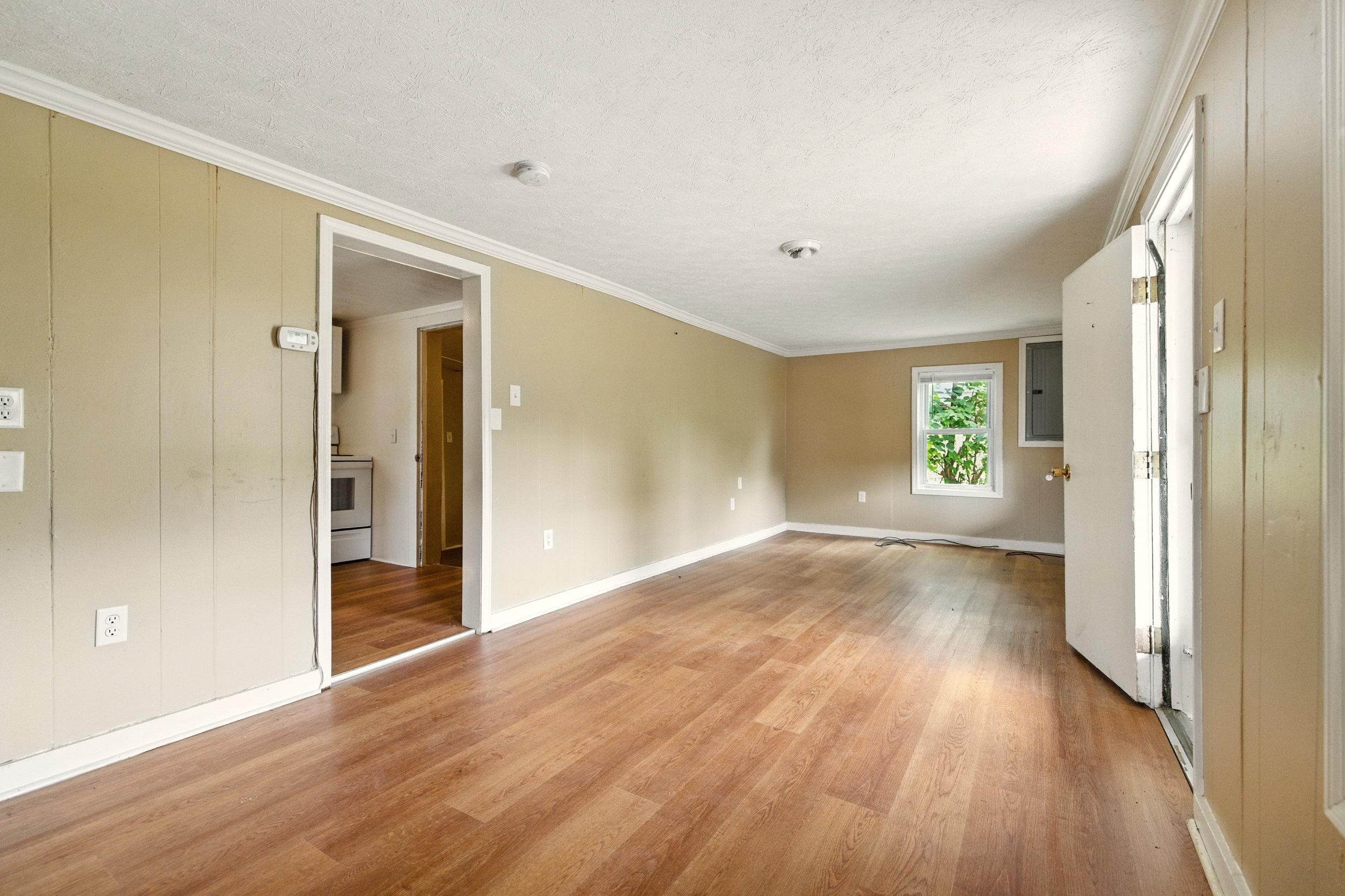 17801 Red Brush Road Elkton, VA 22827 - Photo 9 of 48 wooden floor in an empty room with a window
