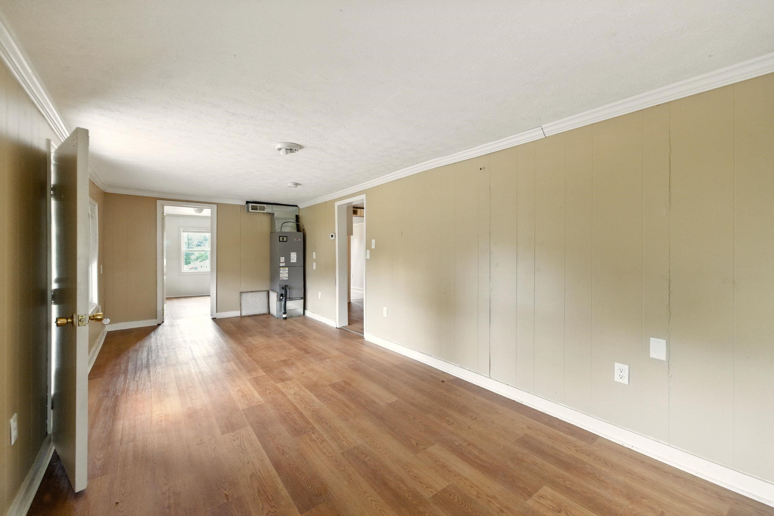 17801 Red Brush Road Elkton, VA 22827 - Photo 10 of 48 a view of an empty room with wooden floor and a window