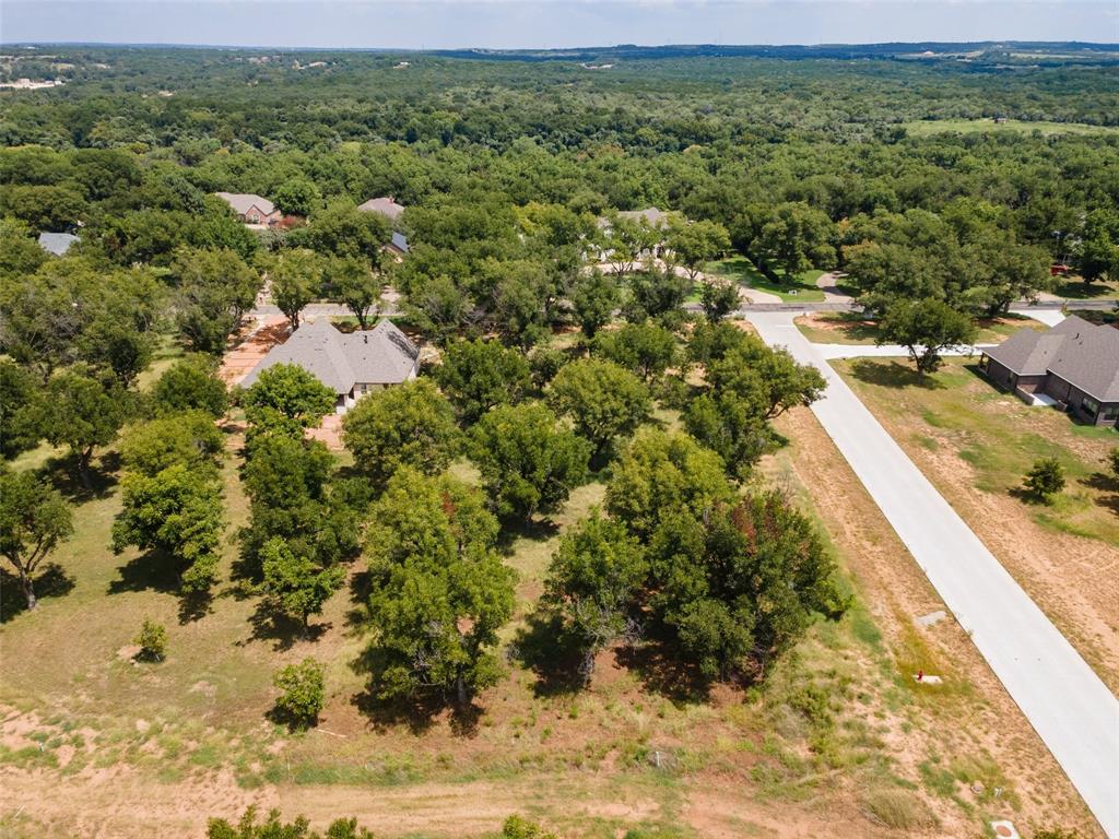8201 Ravenswood Road Granbury, TX 76049 - Photo 5 of 17 a view of a houses with yard