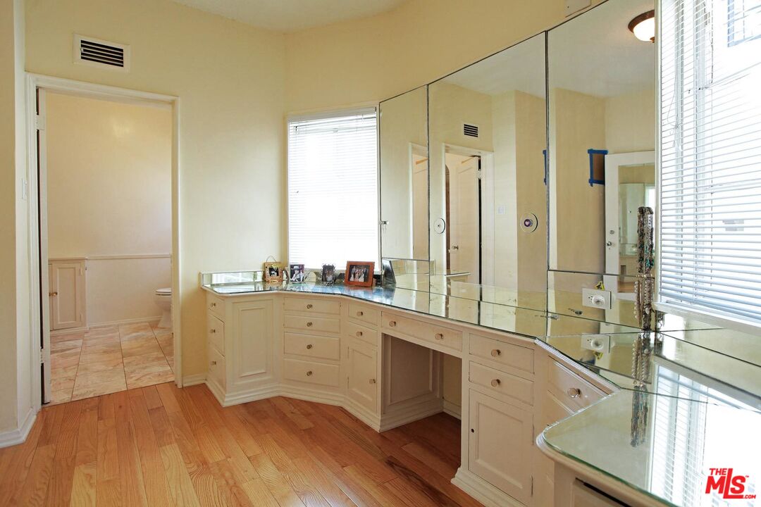 602 North Camden Drive Beverly Hills, CA 90210 - Photo 12 of 18 a bathroom with a tub sink and mirror