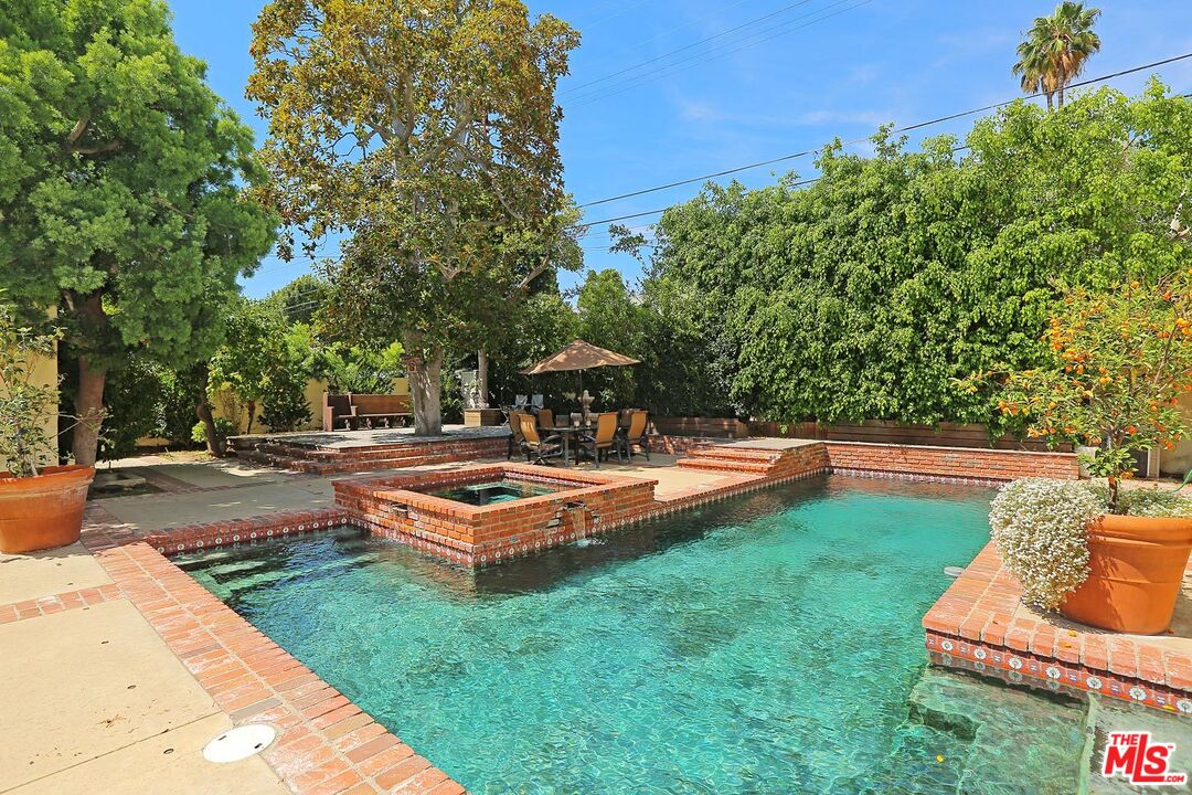602 North Camden Drive Beverly Hills, CA 90210 - Photo 14 of 18 a view of a swimming pool with lounge chair